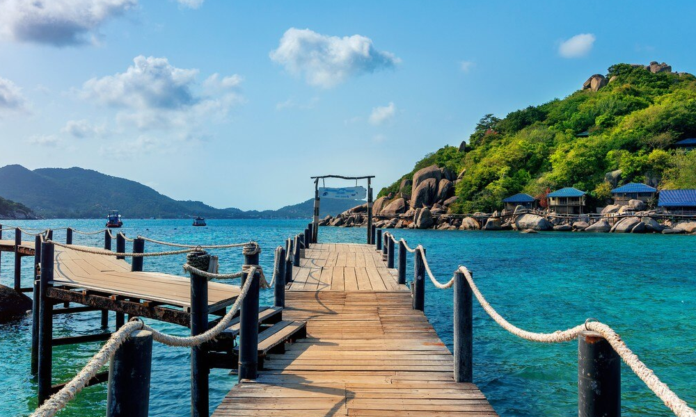 freepik__photo-a-wooden-pier-extends-into-a-clear-turquoise__40271